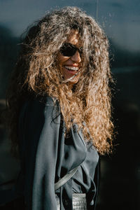 Portrait of a smiling young woman outdoors