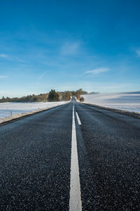 Road in frosty landscape with rime frost, denmark