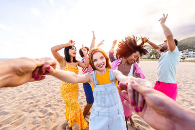 Friends enjoying at beach