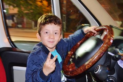 Portrait of boy in car