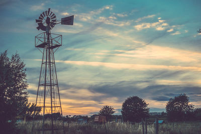 Scenic view of field against cloudy sky