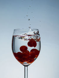 Close-up of wine glass against white background