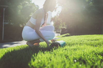 Side view of woman on field