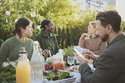 Friends having meal in garden