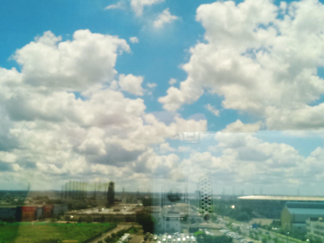 AERIAL VIEW OF BUILDINGS AGAINST SKY