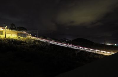 Illuminated suspension bridge at night