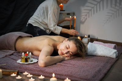 Midsection of man lying down on table