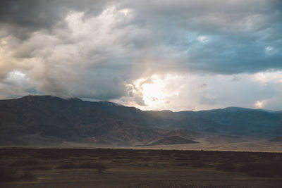 View of landscape against cloudy sky