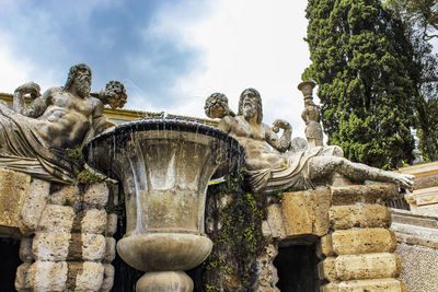 Low angle view of statue against sky