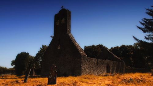 Cemetery against clear blue sky