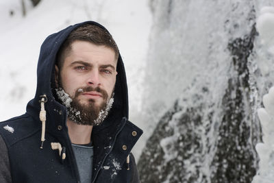 Portrait of young man standing outdoors