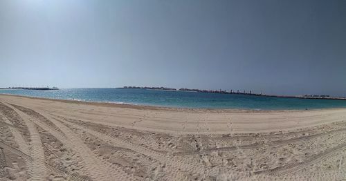 Scenic view of beach against clear sky