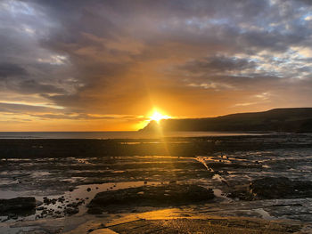 Scenic view of sea against sky during sunset