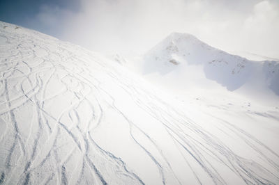 Snowy mountains and blue sky. caucasus mountains, georgia, ski resort gudauri.