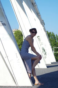 Full length of woman standing against sky