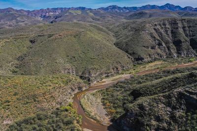 High angle view of road amidst mountains