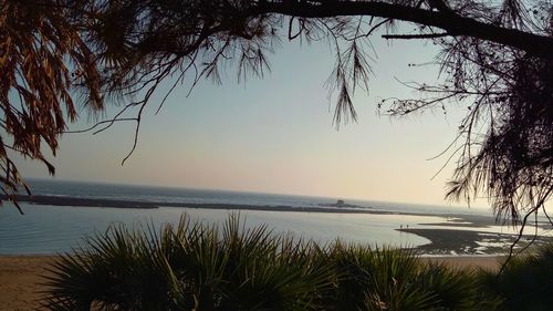 Scenic view of sea against sky at sunset