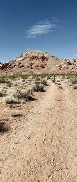 Scenic view of arid landscape against sky