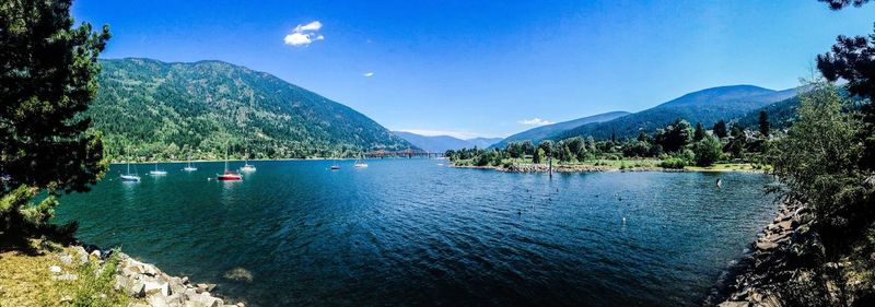 Scenic view of lake against blue sky