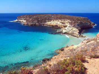 Small island near lampedusa in italy and blue medi
