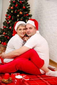 Photo of positive couple having fun christmas. celebrating new year.