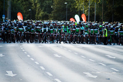 Cyclists waiting at starting line on road