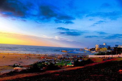 Scenic view of beach against sky during sunset