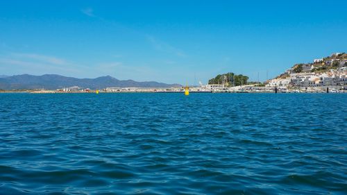 Scenic view of sea against blue sky