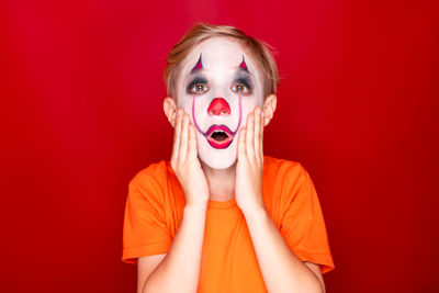 Portrait of young woman with red face