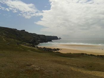 Scenic view of sea against cloudy sky