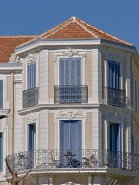 Low angle view of old building against blue sky