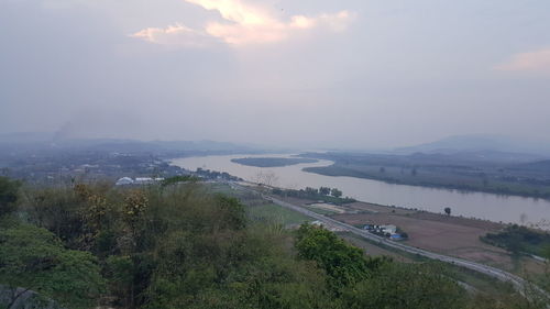 High angle view of road by river against sky