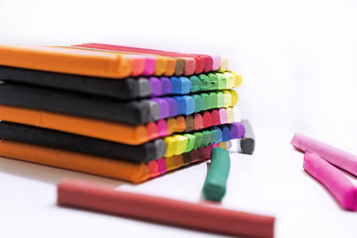 Close-up of multi colored pencils on table