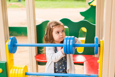 Cute girl playing in playground