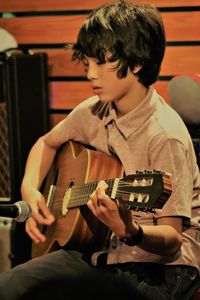 Full length of man playing guitar