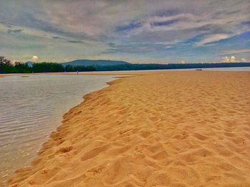 Scenic view of beach against sky