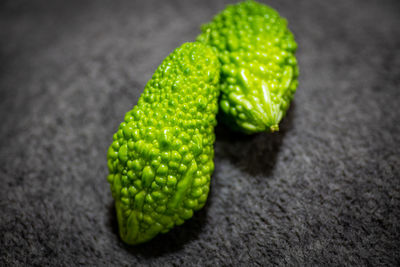 High angle view of green lemon on table