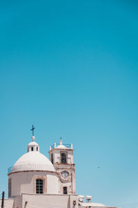 Low angle view of building against clear blue sky