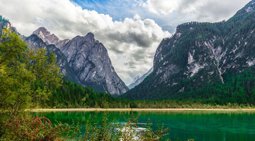 Scenic view of lake and mountains against sky