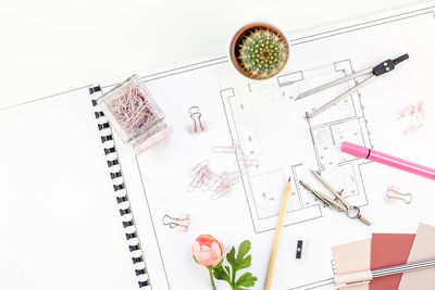 High angle view of objects on table against white background