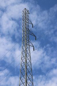 Low angle view of communications tower against sky