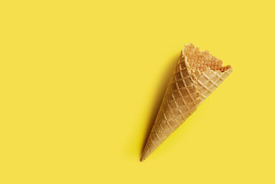 Close-up of yellow leaf against white background