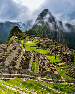 Scenic view of mountain against cloudy sky