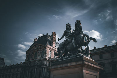 Low angle view of statue against sky