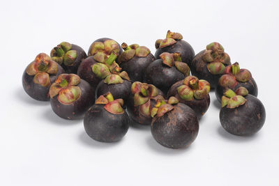 Close-up of blueberries against white background