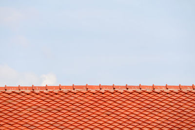 Roof on top and blue sky white cloud background. pattern of roof. tile top protection