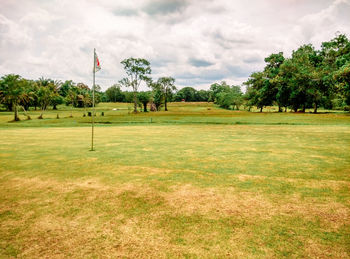 View of golf course against sky