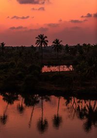Scenic view of lake against sky at sunset