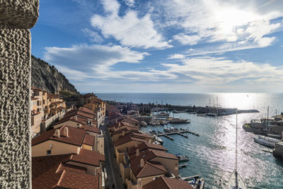 Panoramic view of sea and buildings against sky