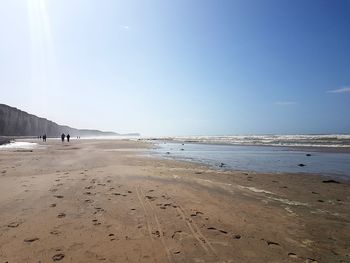 Scenic view of beach against clear sky